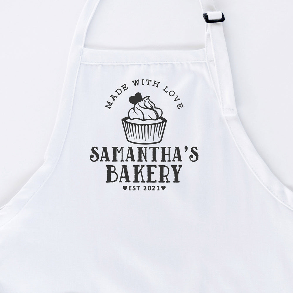 
                  
                    a personalized cupcake baking apron in white
                  
                
