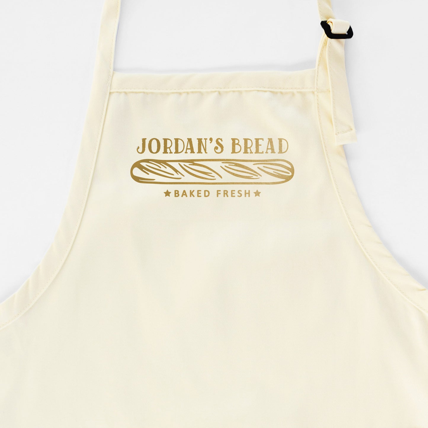 
                  
                    a personalized bread baking apron in natural
                  
                
