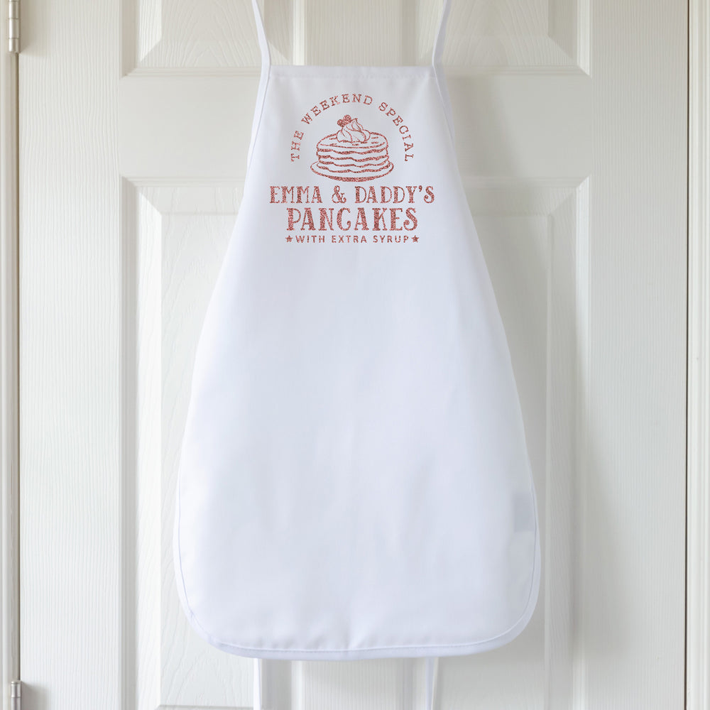 
                  
                    a personalized pancake apron in white
                  
                