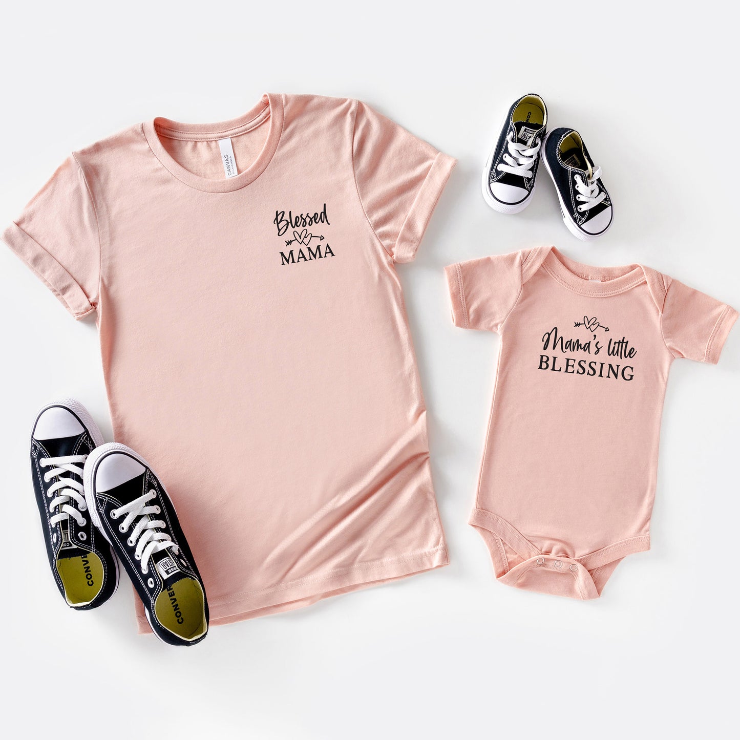 
                  
                    a blessed mama shirt in peach, shown with a matching baby onesie
                  
                
