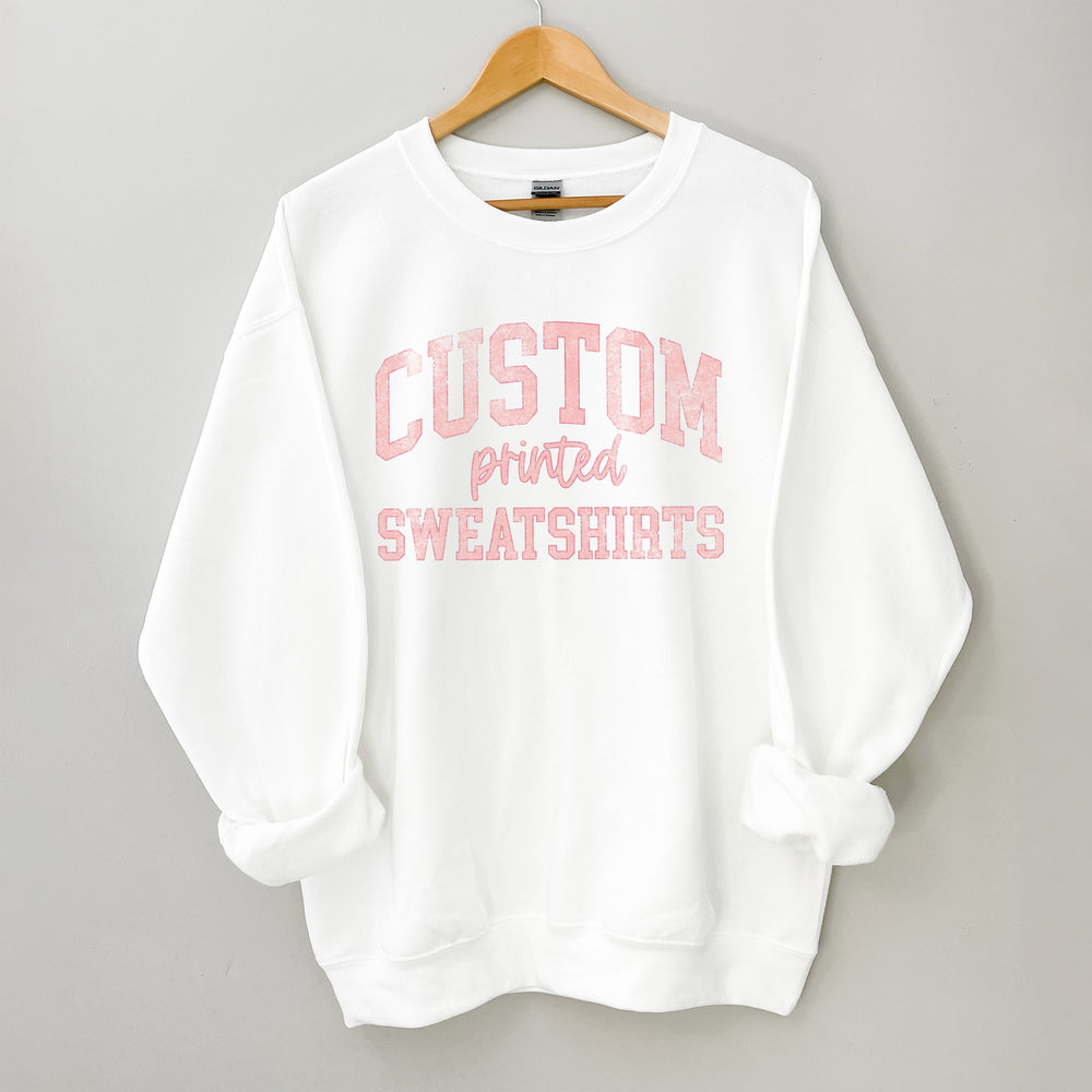
                  
                    a white sweatshirt with text that reads "design your own sweatshirt"
                  
                