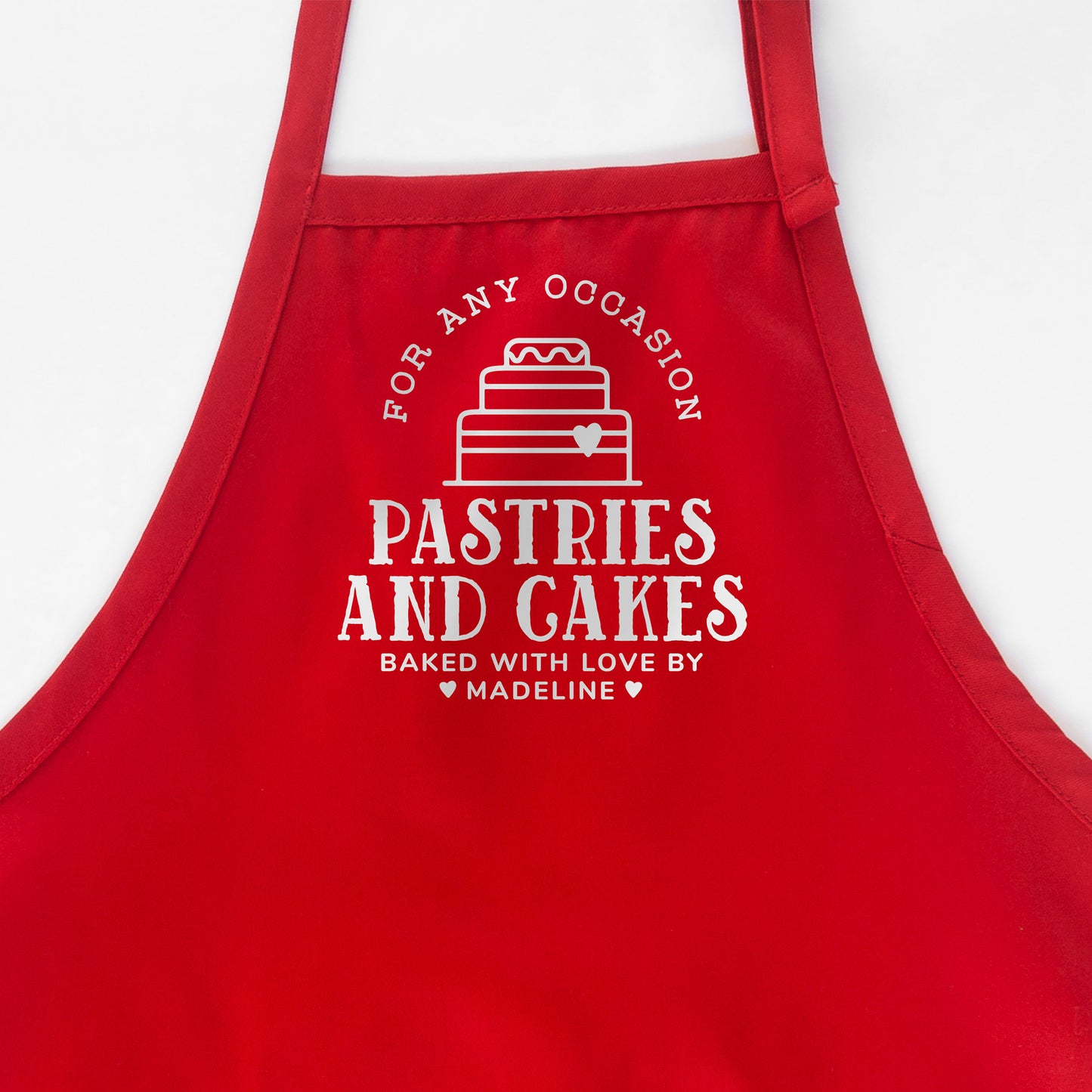 
                  
                    A personalized cake baking apron in red
                  
                