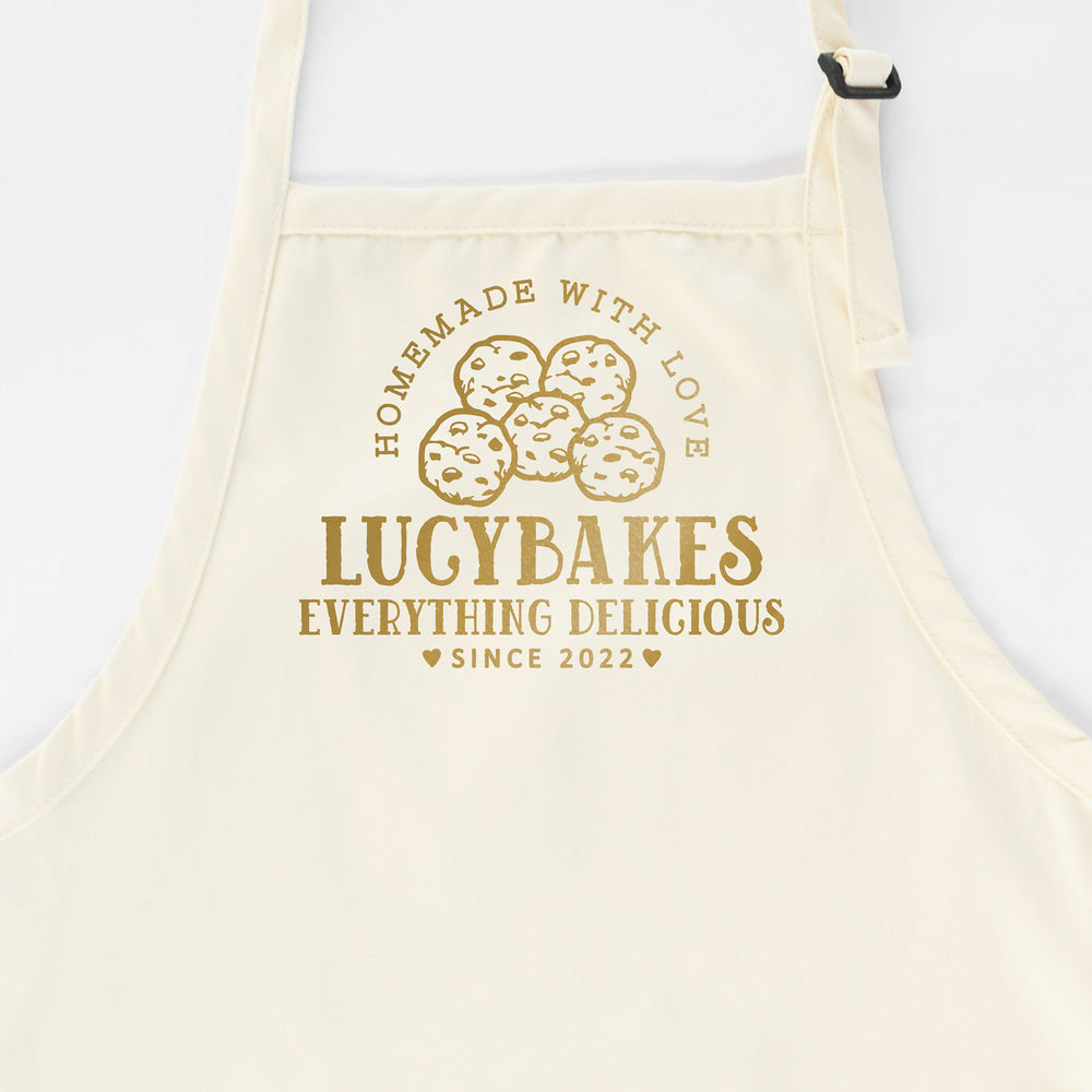 
                  
                    a personalized cookie baking apron in natural
                  
                