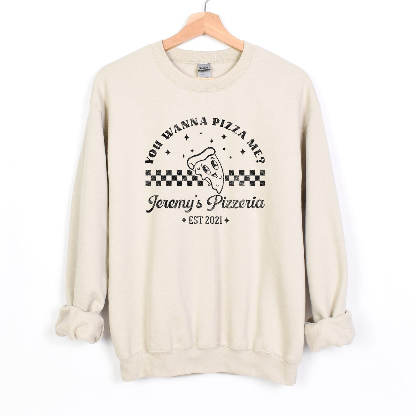 
                  
                    a personalized retro pizzeria sweatshirt in sand
                  
                
