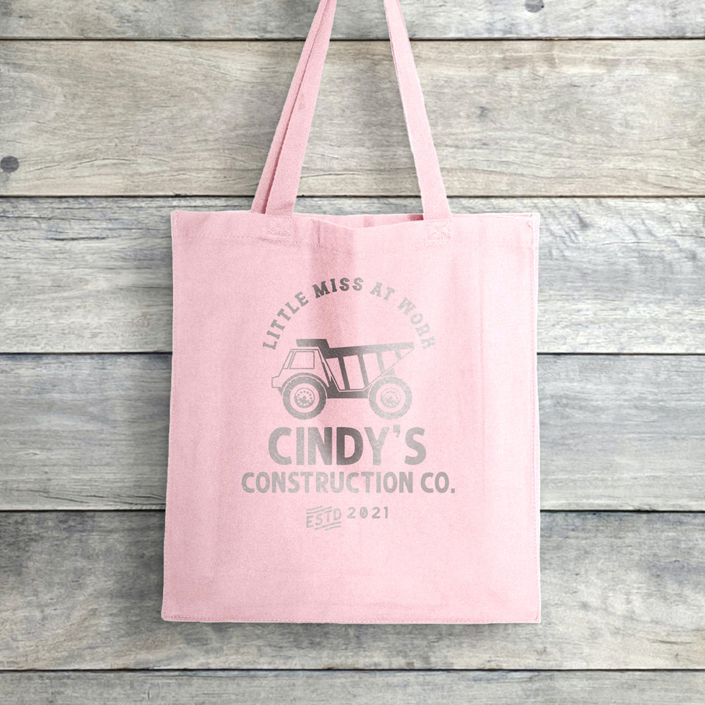 
                  
                    a personalized dump truck tote in pink
                  
                