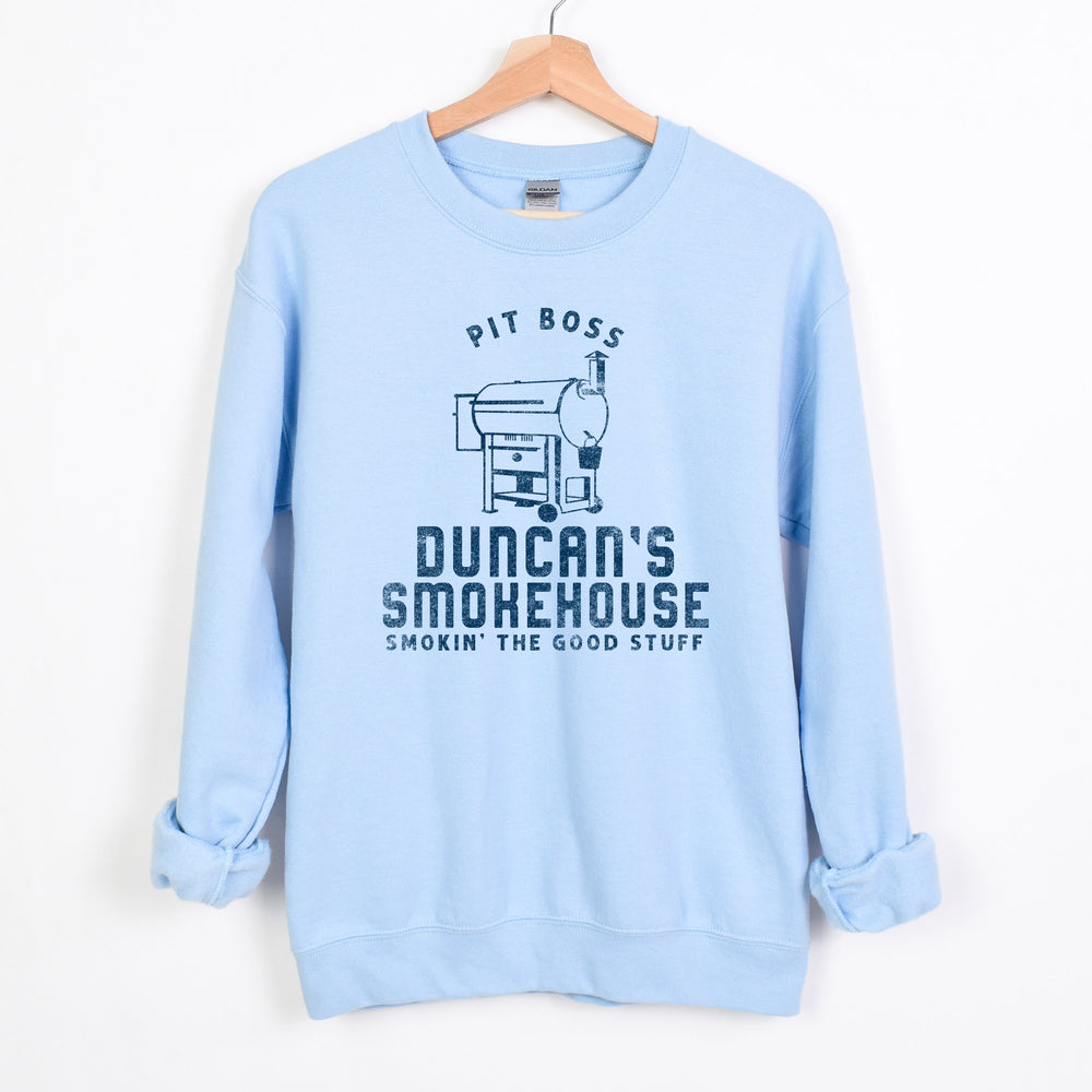 
                  
                    a personalized traeger inspired sweatshirt in light blue
                  
                