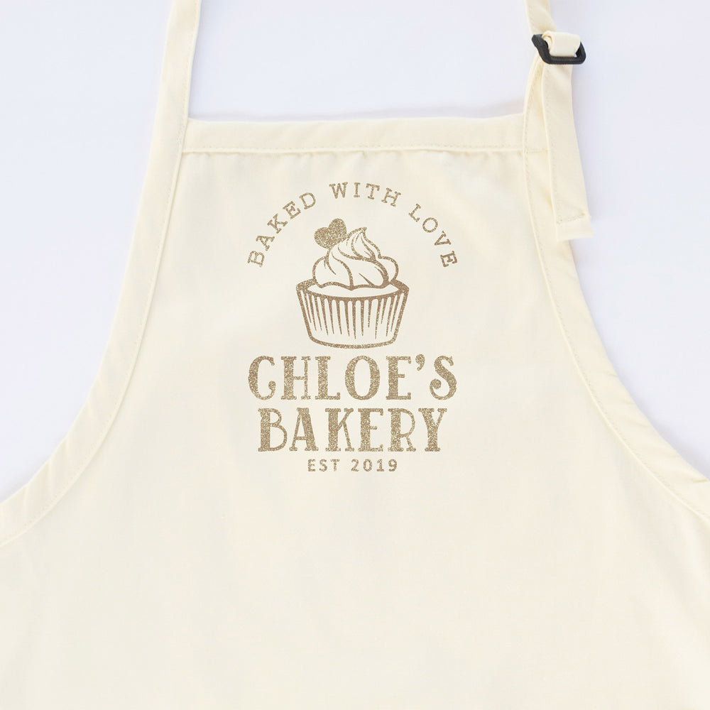 
                  
                    a personalized cupcake baking apron in natural
                  
                
