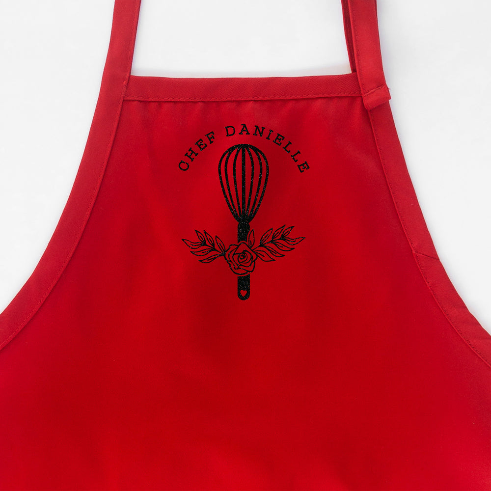 
                  
                    a customized chef apron in red
                  
                