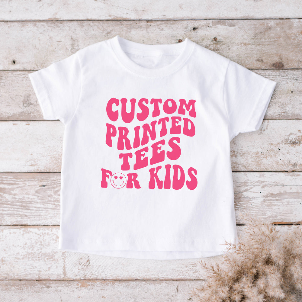
                  
                    a custom printed kid's shirt in white
                  
                
