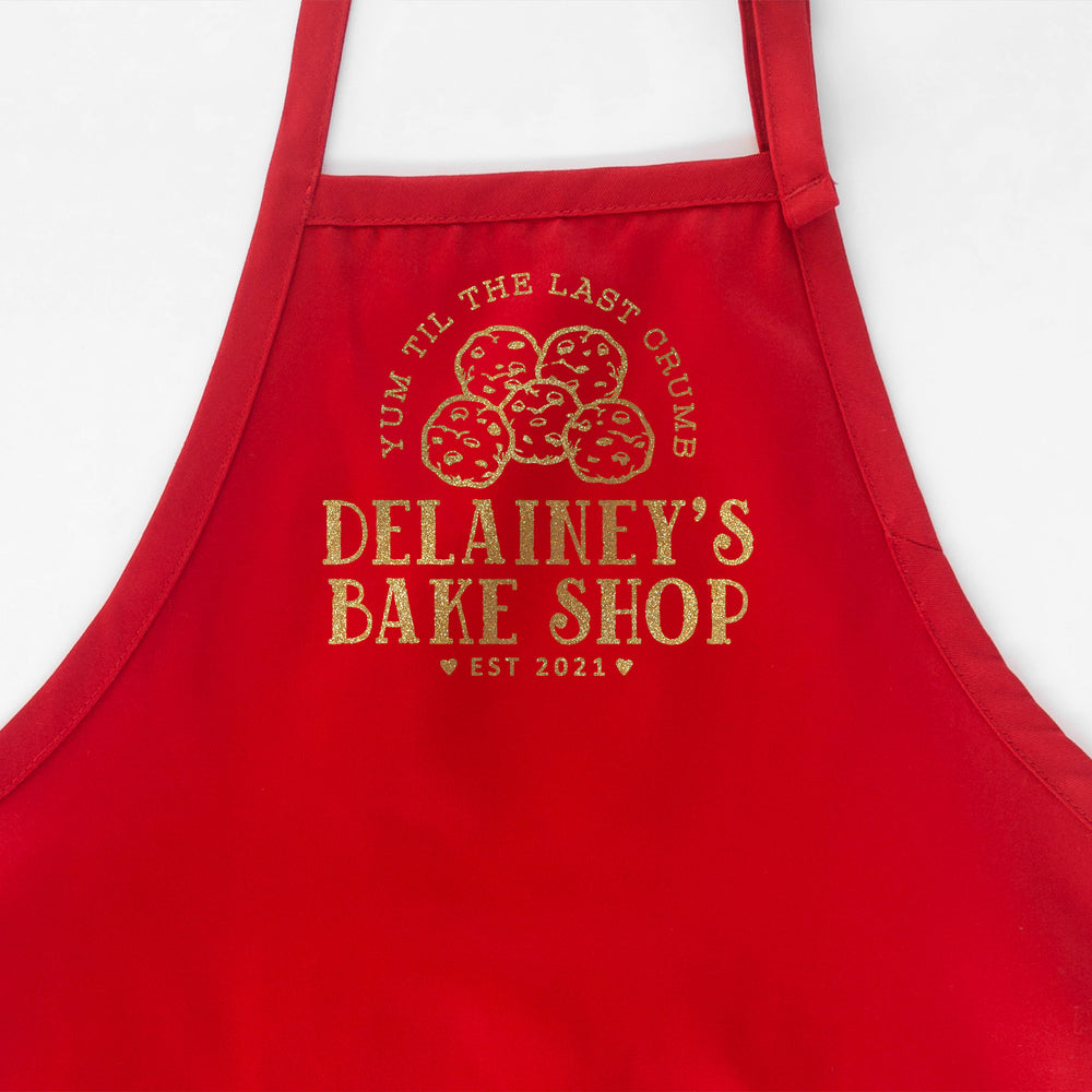 
                  
                    a personalized cookie baking apron in red
                  
                