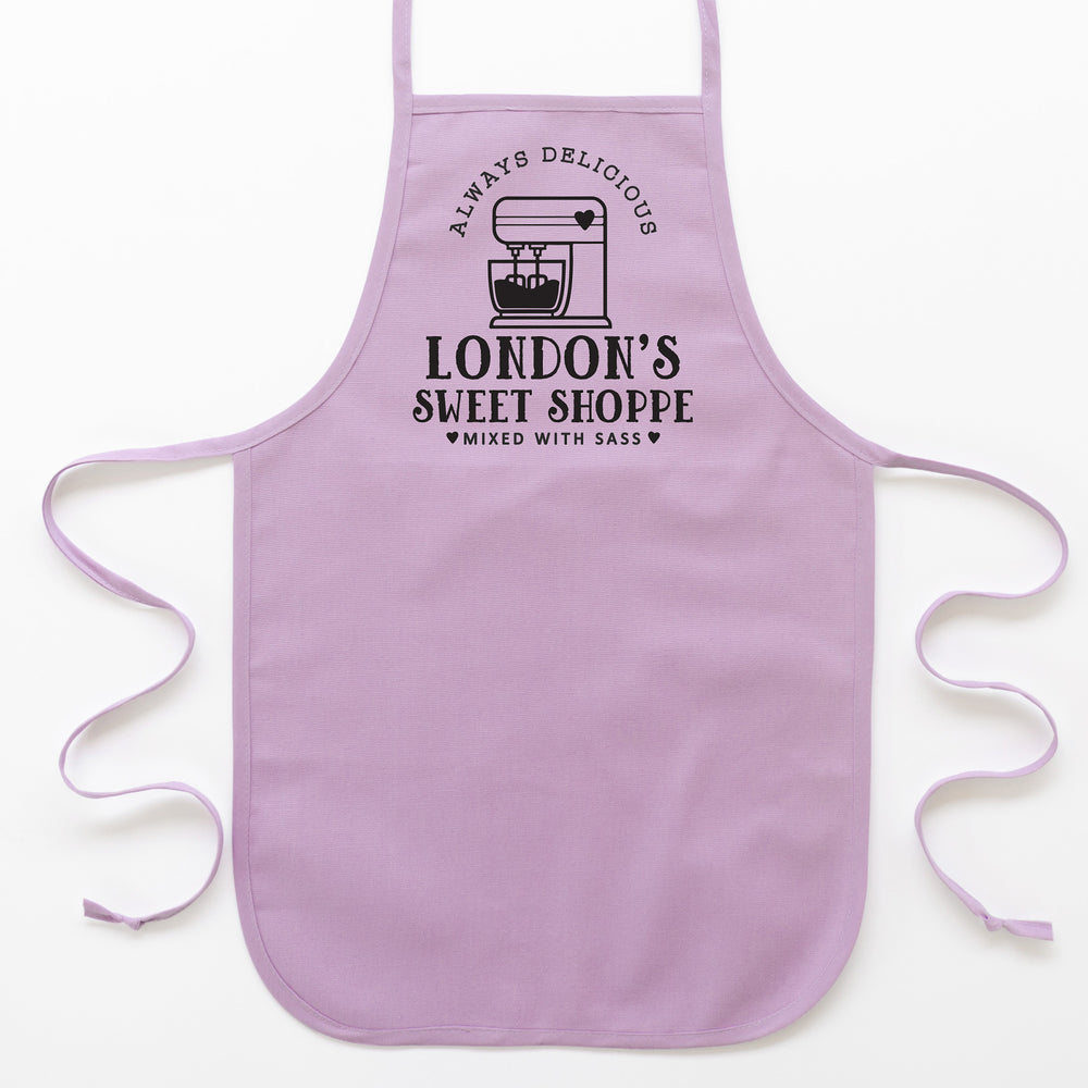 
                  
                    a toddler personalized baking apron in purple pastel
                  
                
