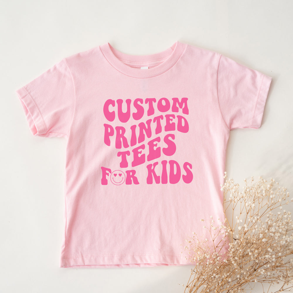 
                  
                    a custom printed kid's shirt in pink
                  
                