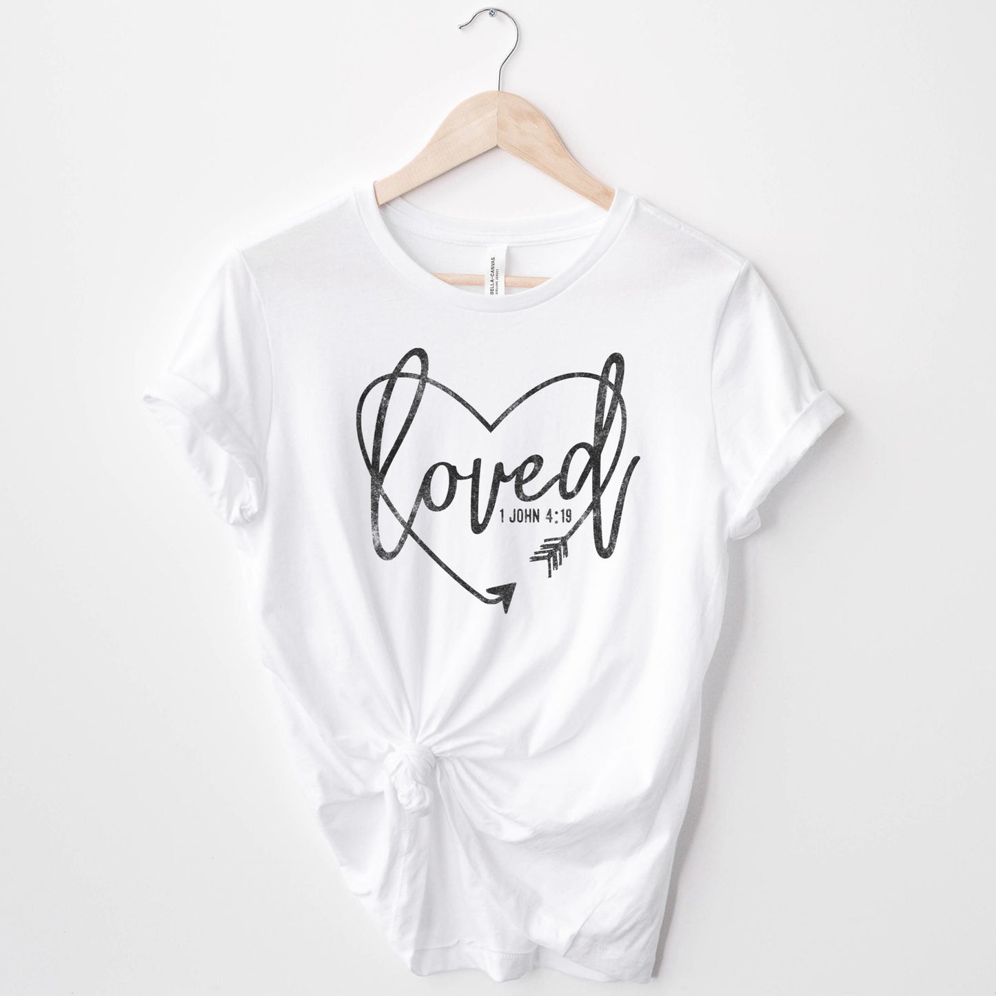 
                  
                     a loved christian tee in white
                  
                