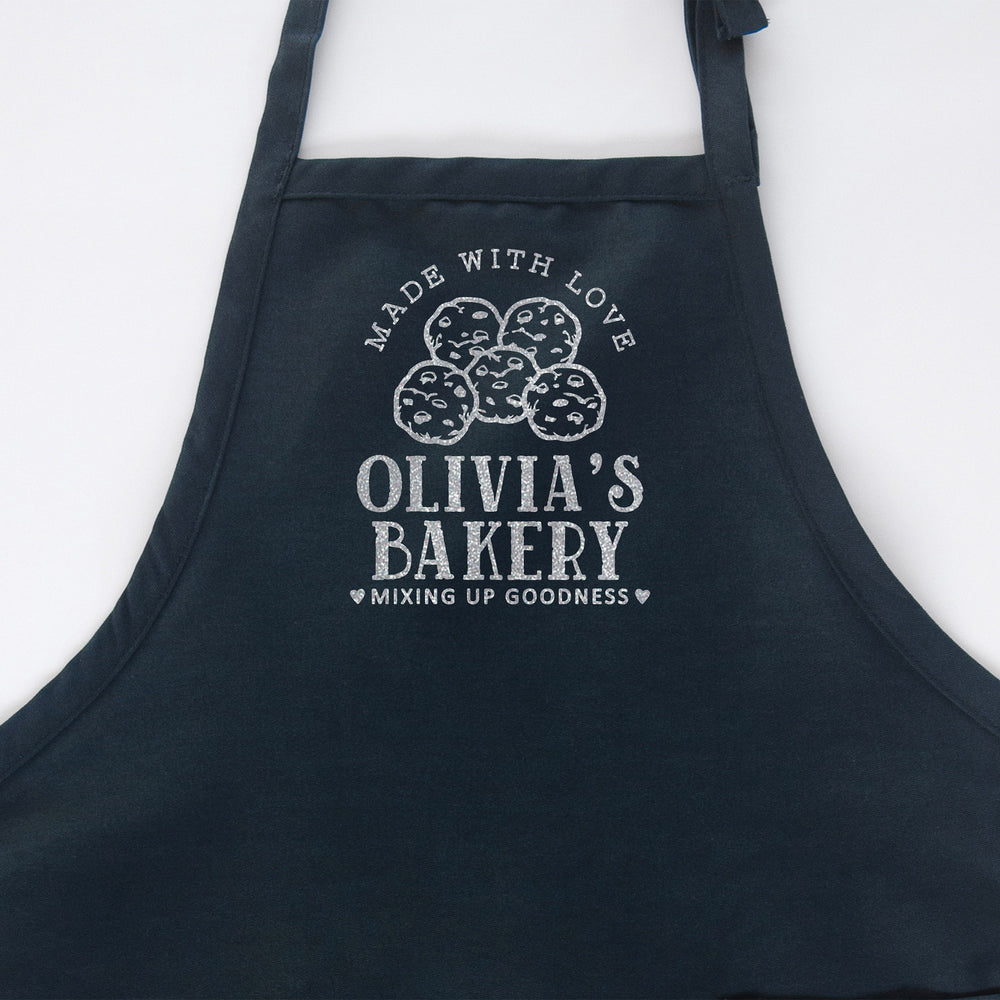 
                  
                    a personalized cookie baking apron in navy
                  
                