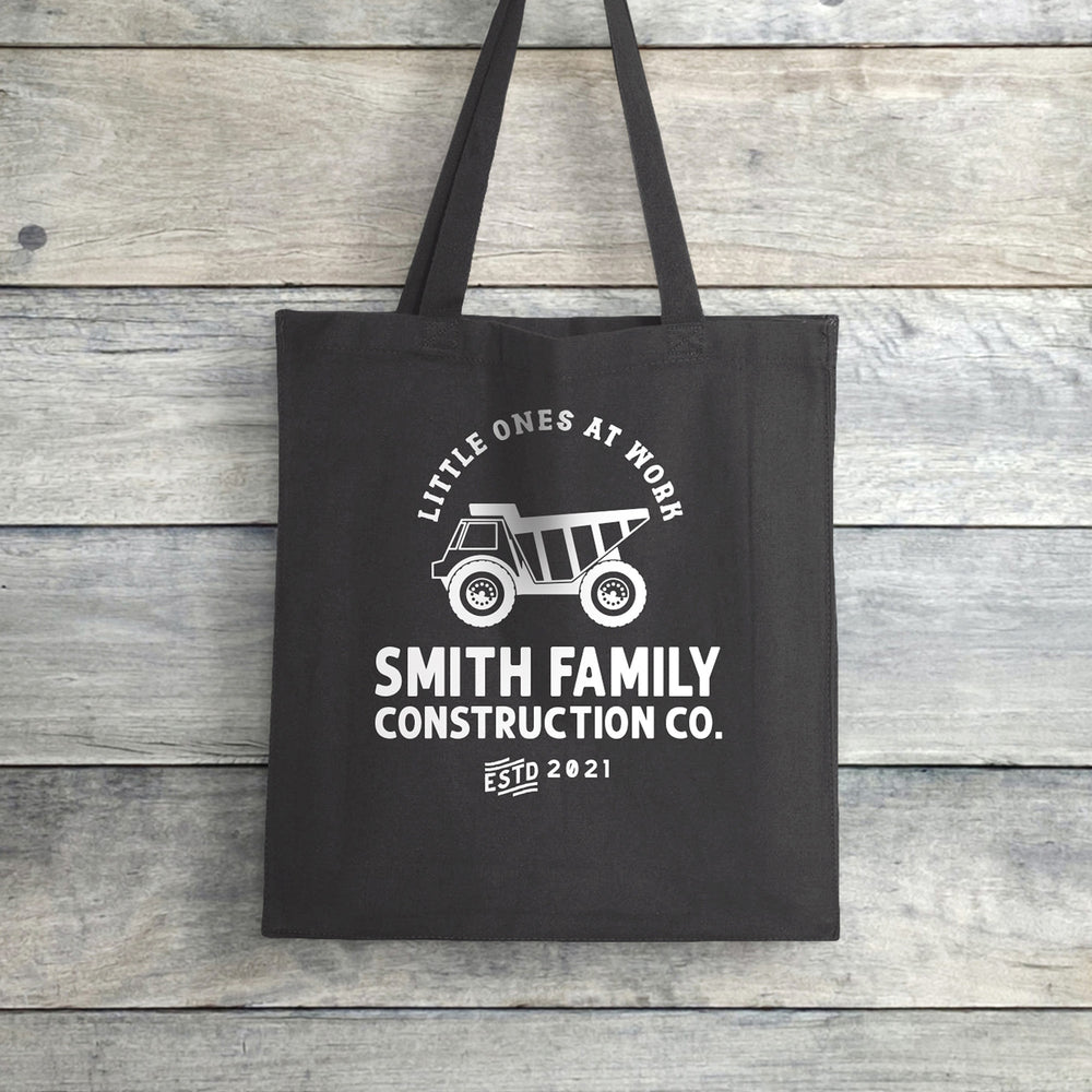 
                  
                    a personalized dump truck tote in grey
                  
                