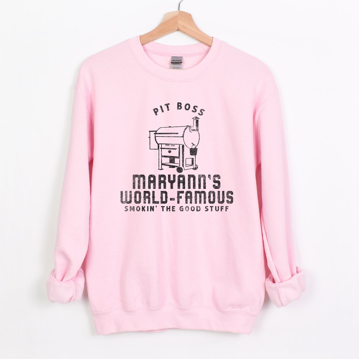 
                  
                    a personalized traeger inspired sweatshirt in light pink
                  
                