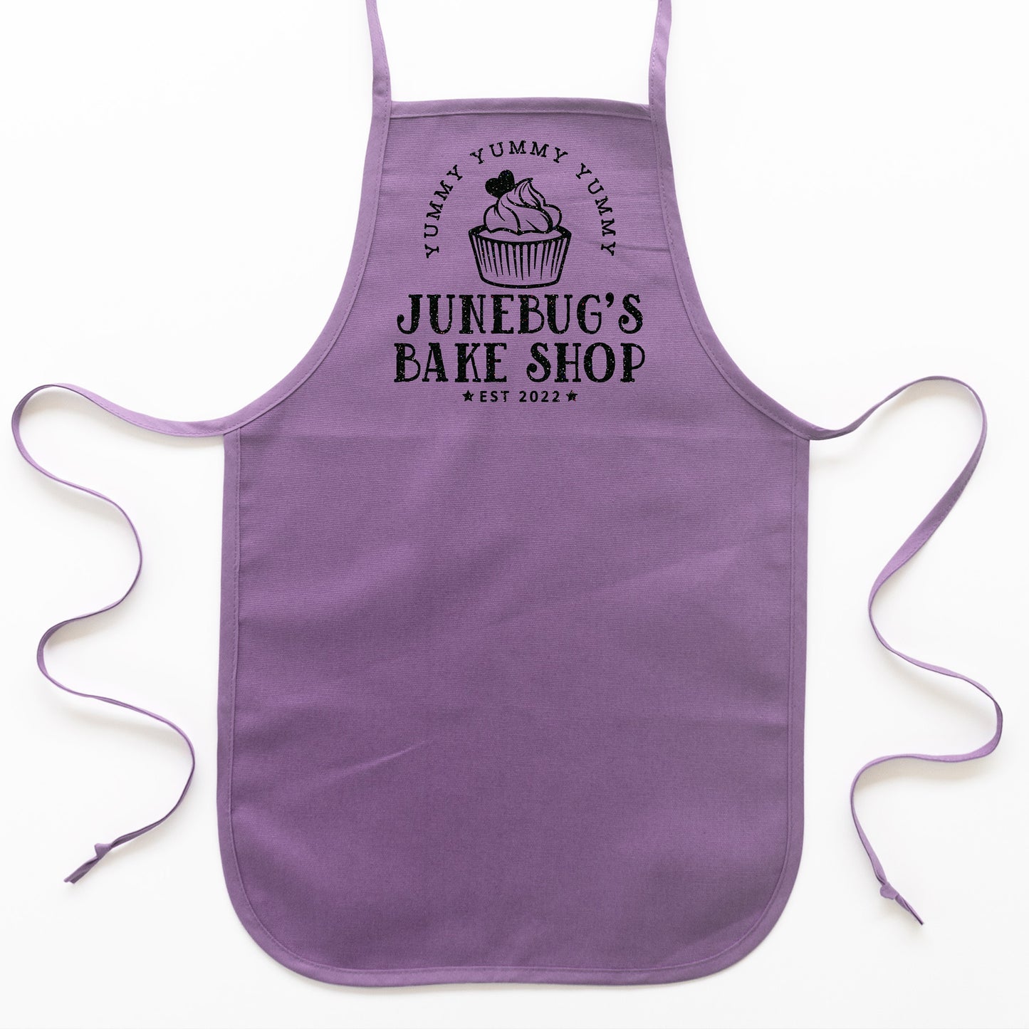 
                  
                    toddler personalized cupcake baking aprons in purple
                  
                