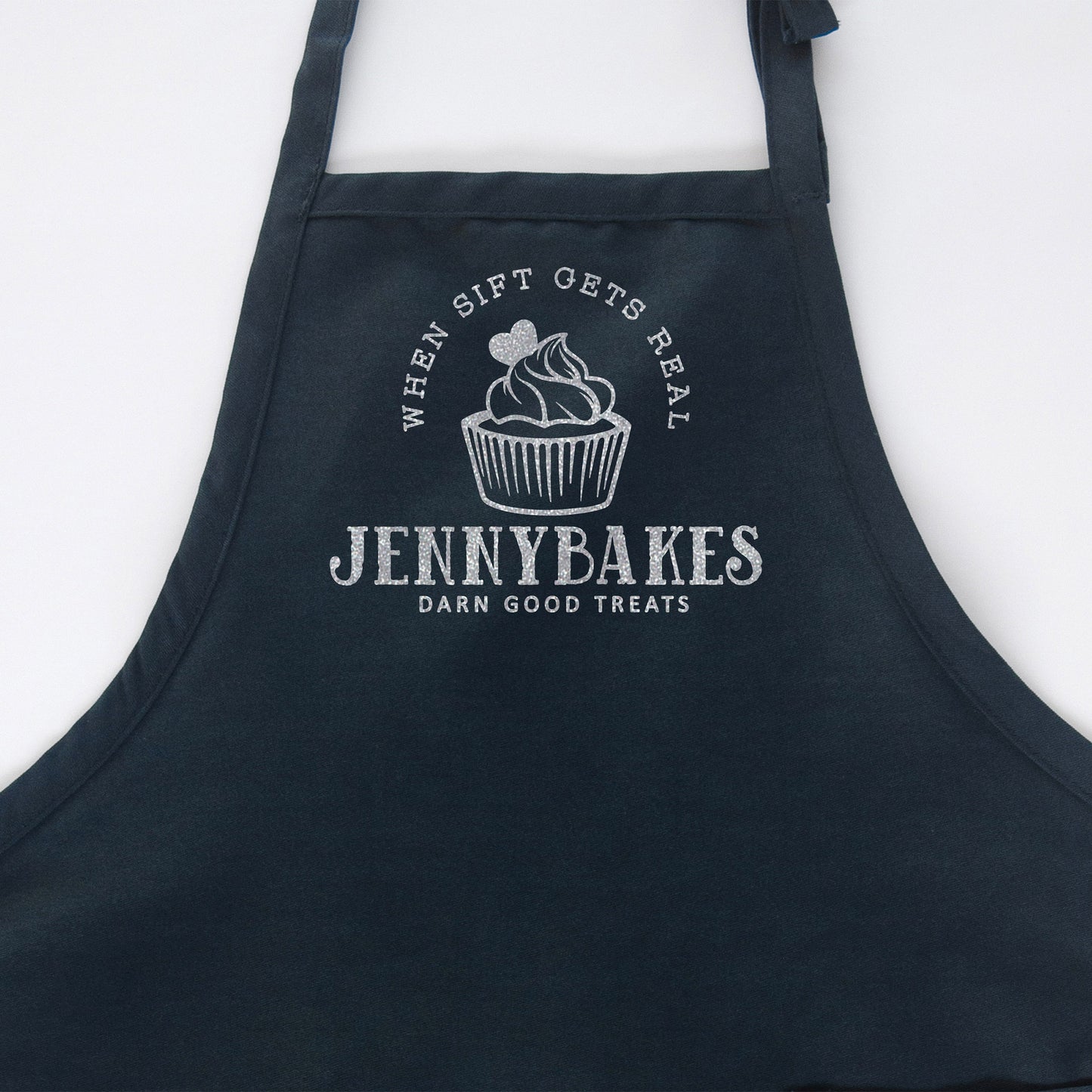 
                  
                    a personalized cupcake baking apron in navy
                  
                