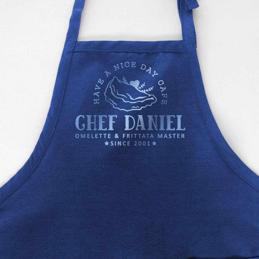 
                  
                    a personalized omelette apron in royal
                  
                