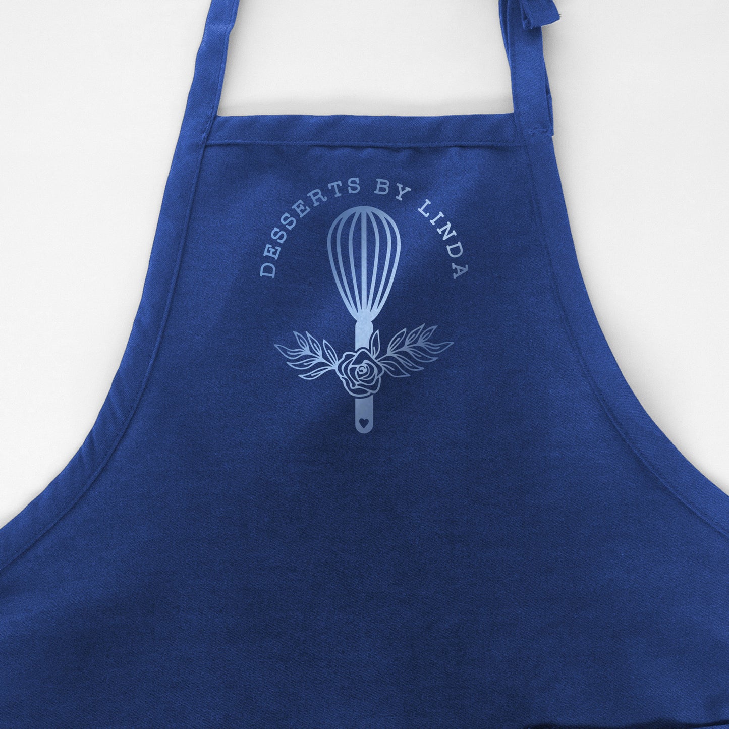 
                  
                    a customized chef apron in royal
                  
                
