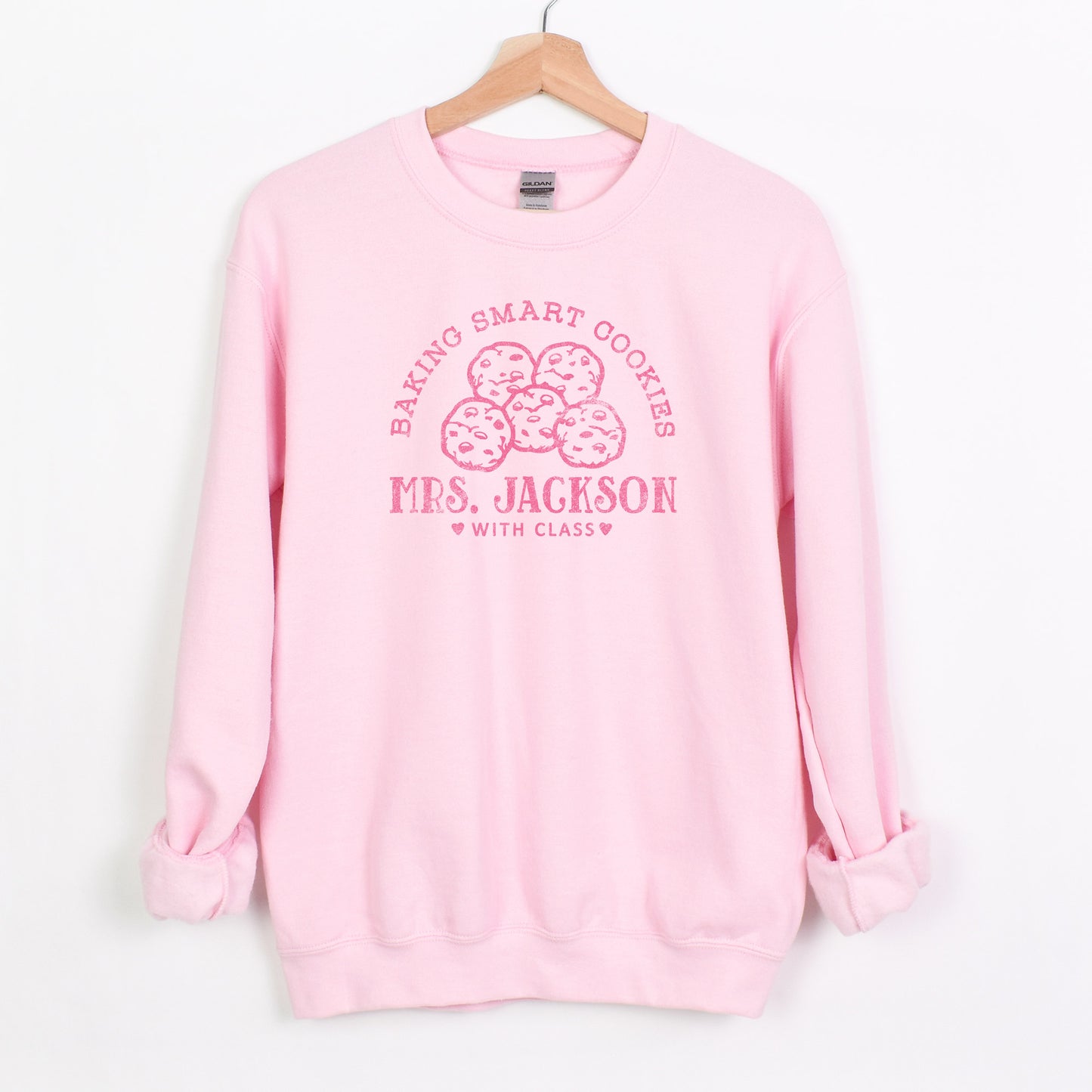 a personalized cookie baker sweatshirt in light pink