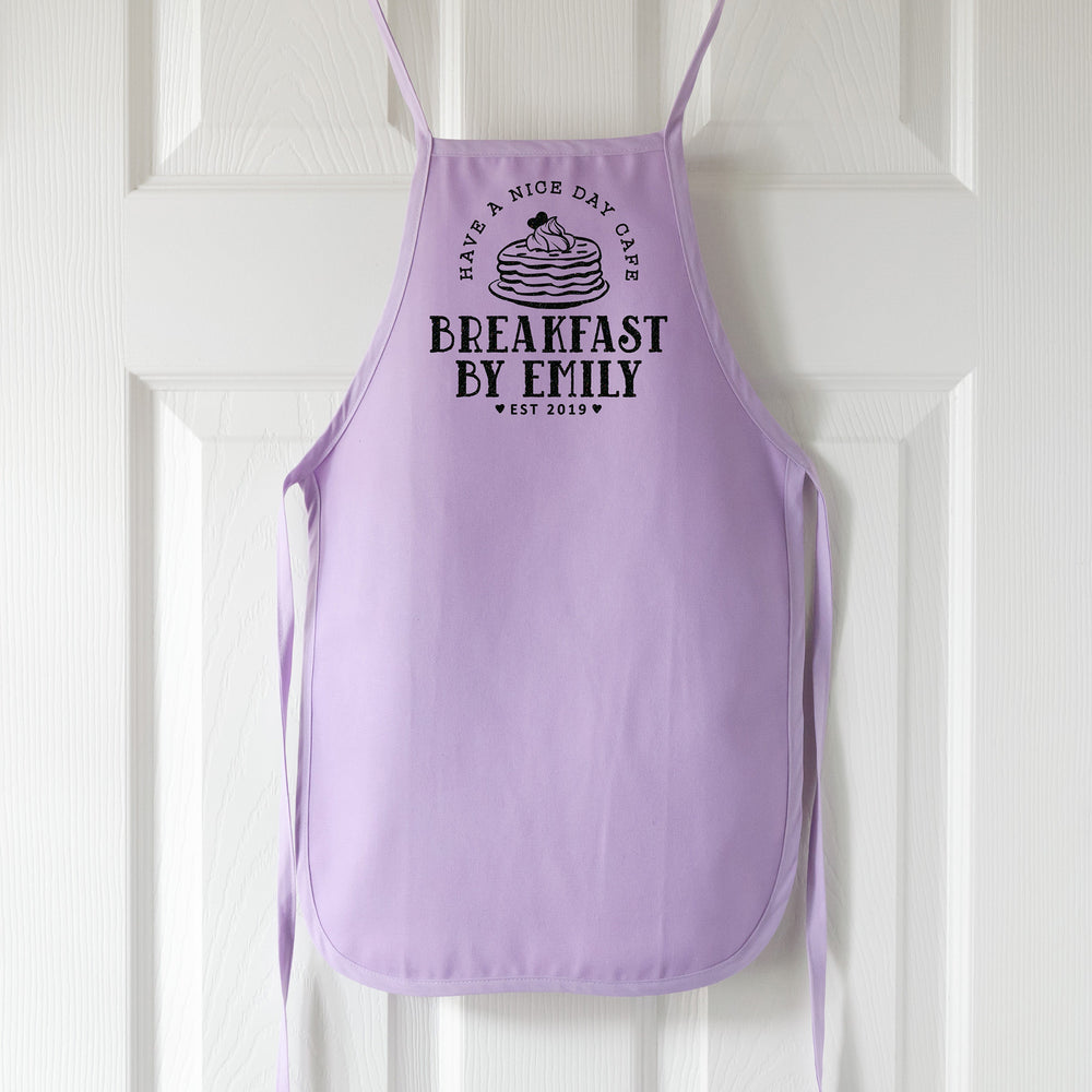 
                  
                    a toddler personalized pancake apron in purple pastel
                  
                