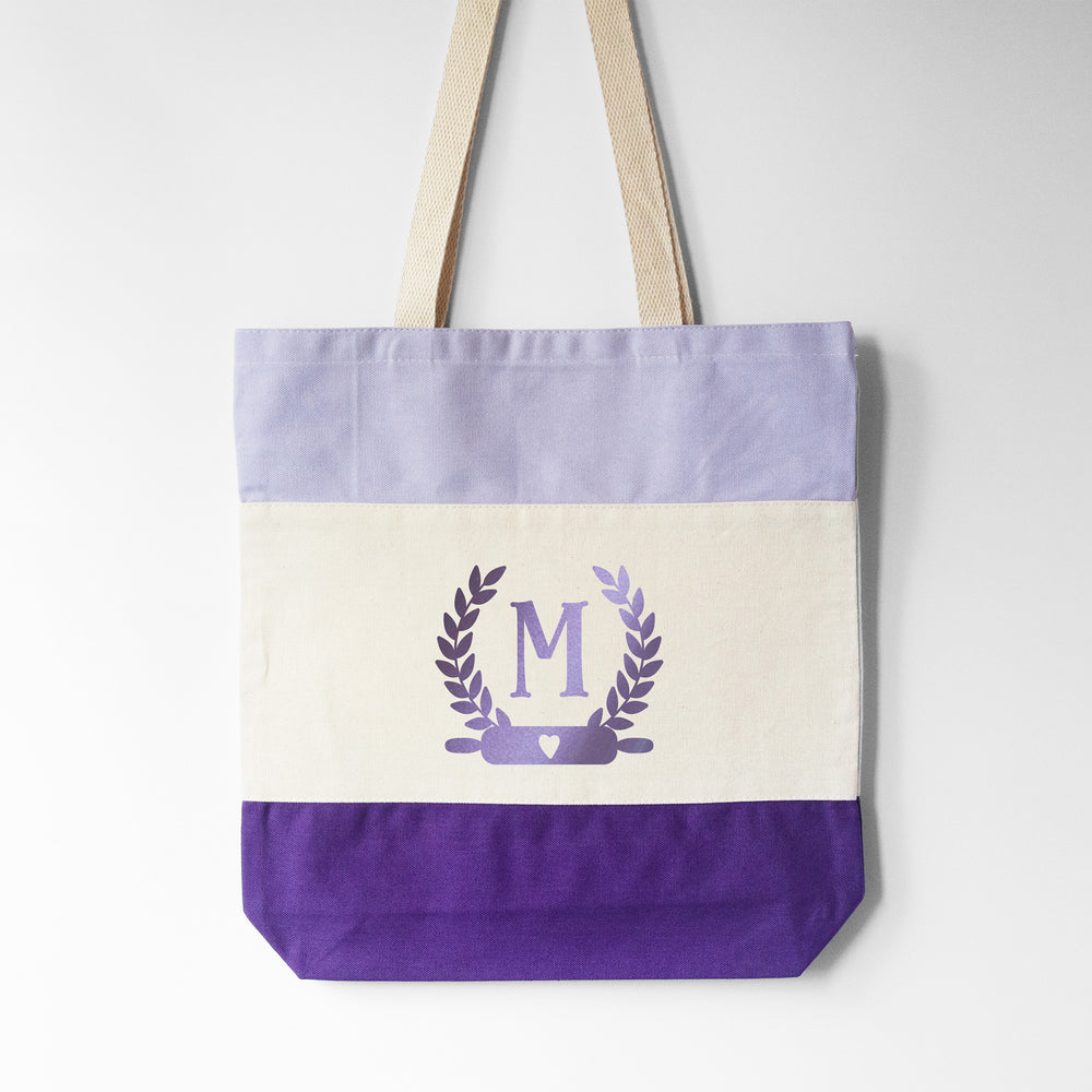 
                  
                    a monogrammed baking tote bag in purple
                  
                