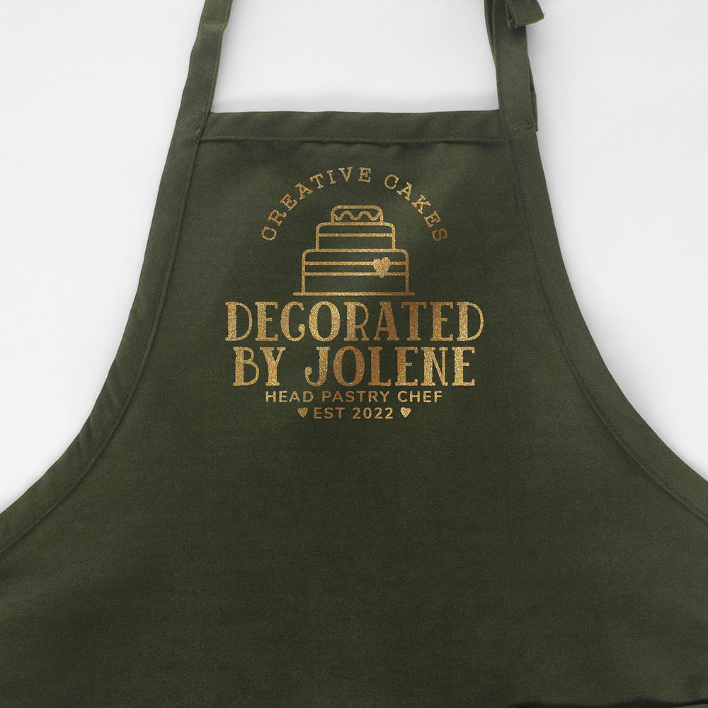 
                  
                    A personalized cake baking apron in green
                  
                