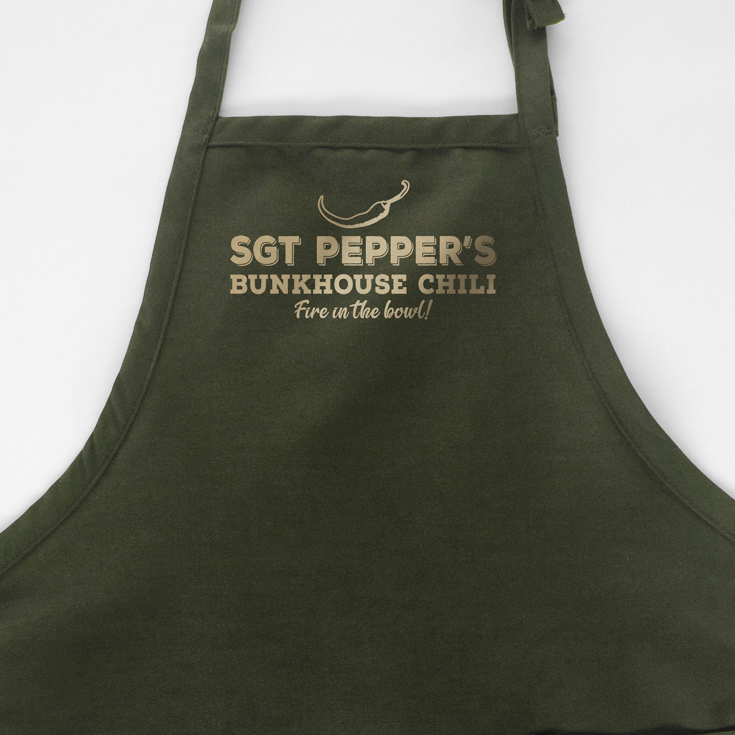 
                  
                    a personalized chili cook off apron in green
                  
                