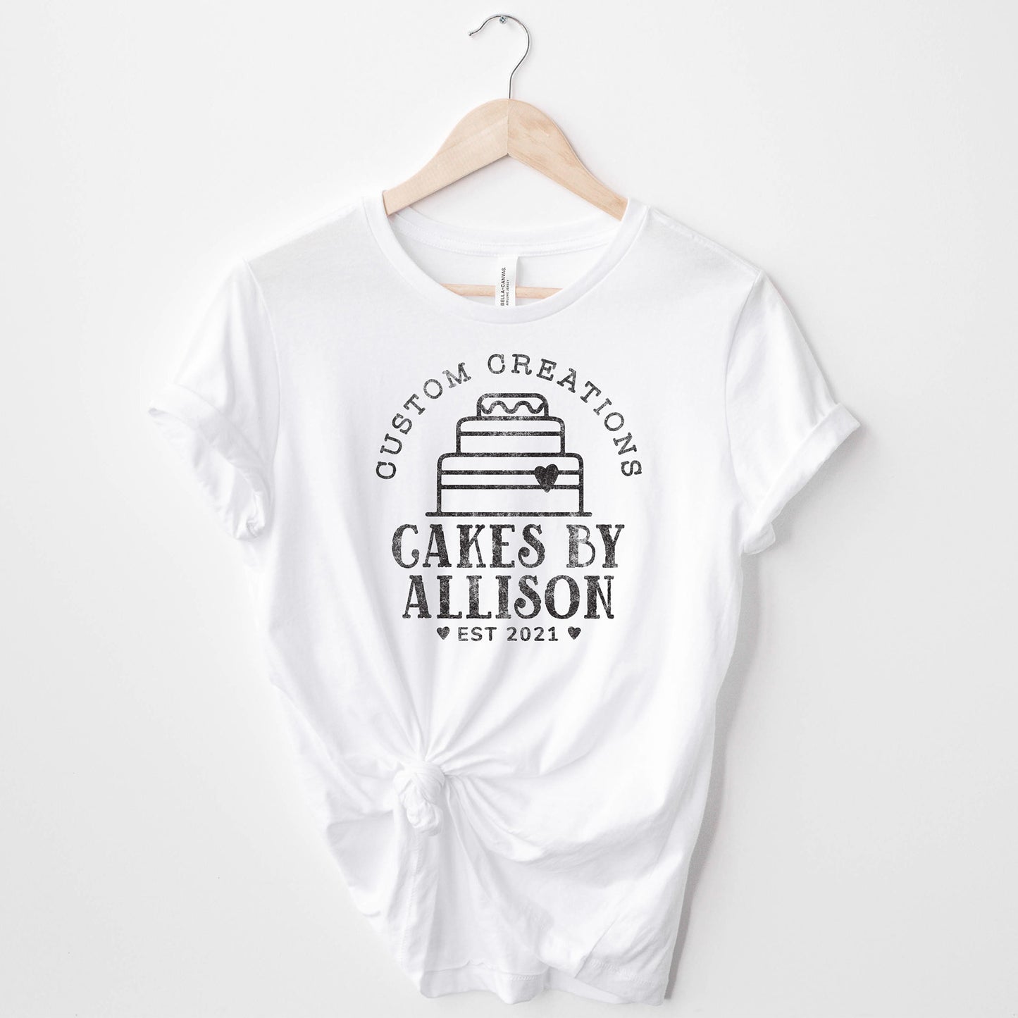 
                  
                    a personalized cake baking shirt in white
                  
                