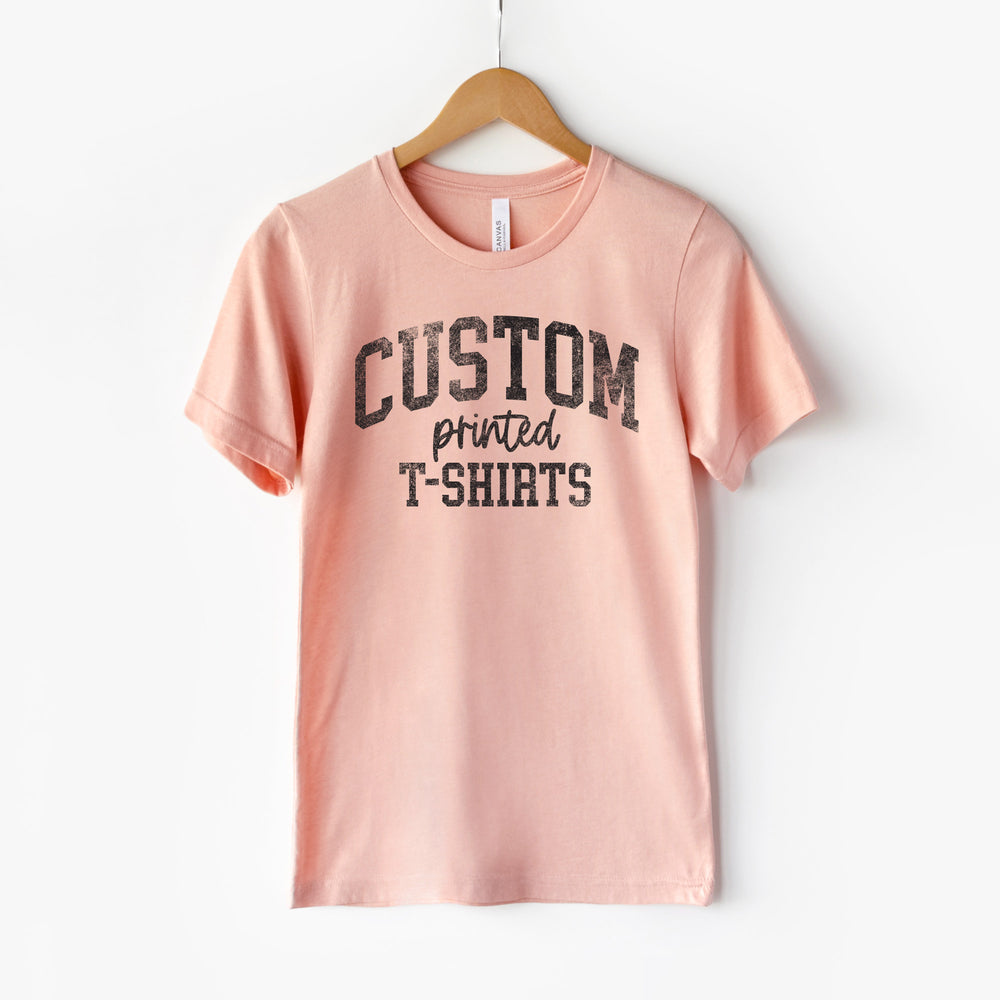 
                  
                    a hanging t-shirt in peach
                  
                