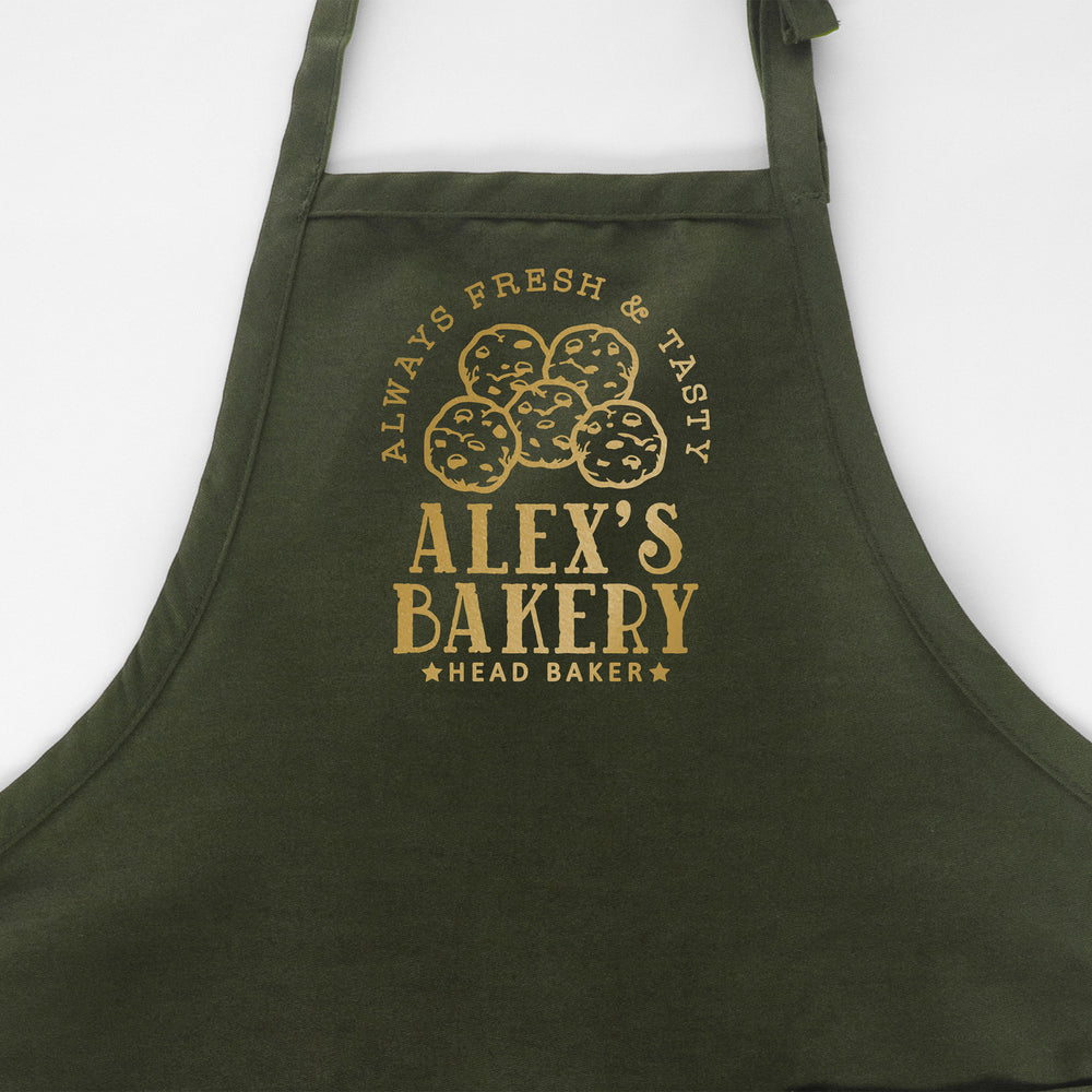
                  
                    a personalized cookie baking apron in green
                  
                