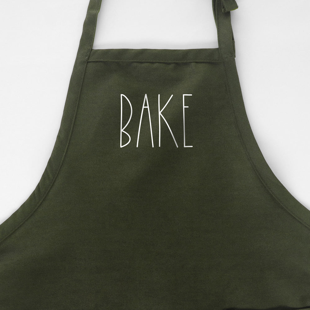
                  
                    a Bake apron in green
                  
                