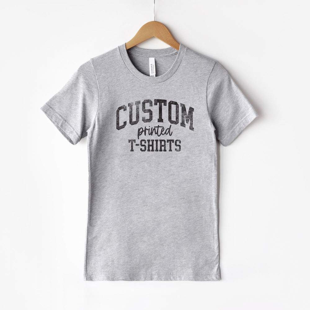 
                  
                    a hanging t-shirt in grey
                  
                