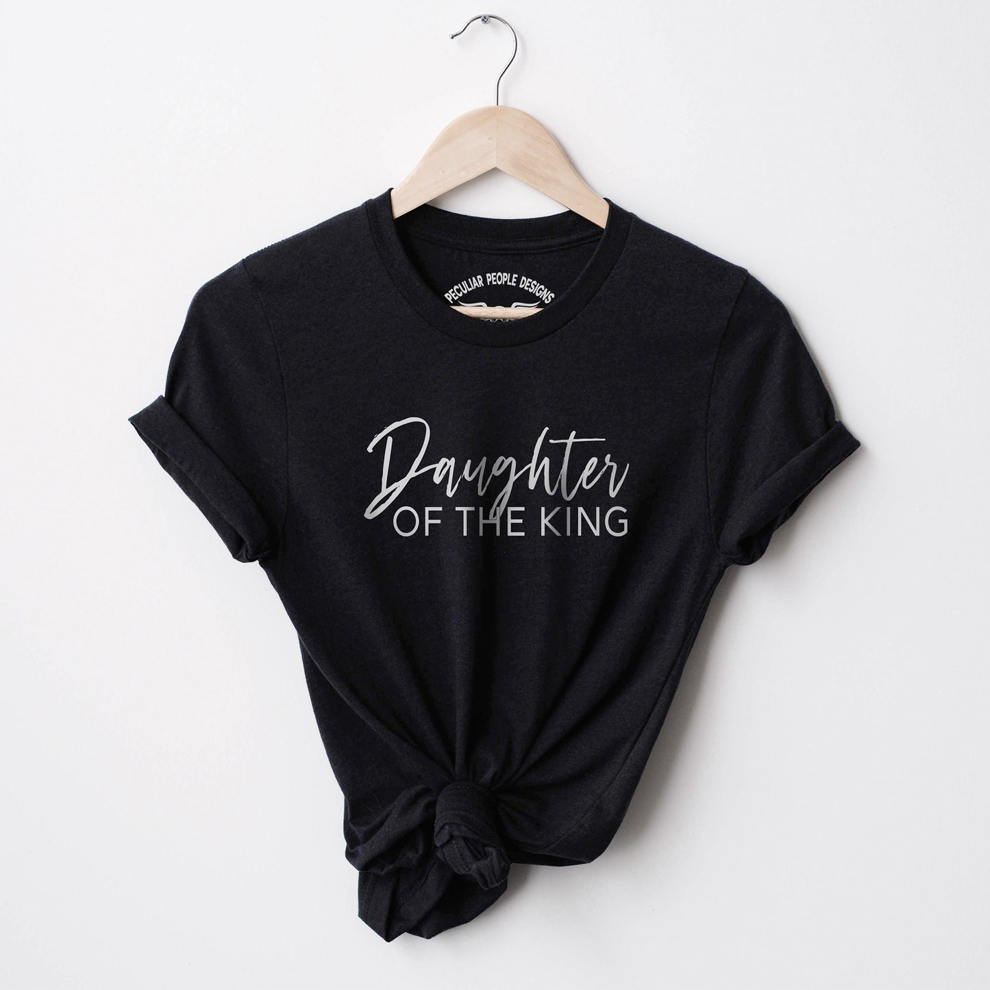 
                  
                     a Daughter of the king shirt in black
                  
                