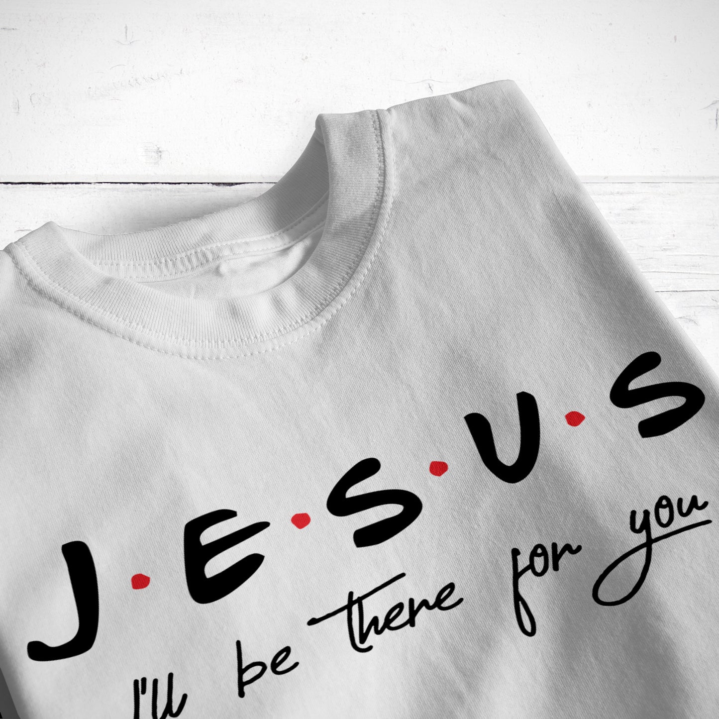 
                  
                    a folded grey tee printed with Jesus, I'll be there for you svg in black
                  
                