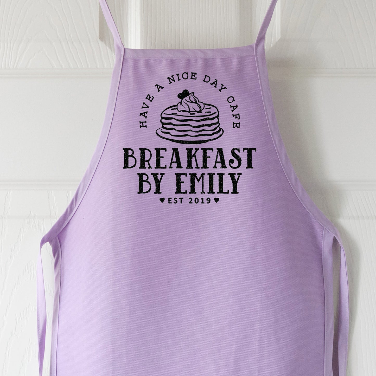 
                  
                    a personalized kid's pancake apron in purple
                  
                