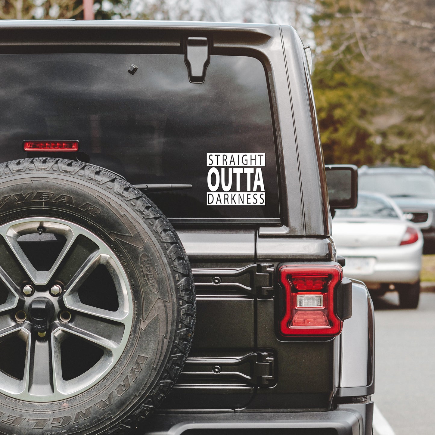 
                  
                    straight outta darkness svg shown as a decal on a Jeep's rear window
                  
                